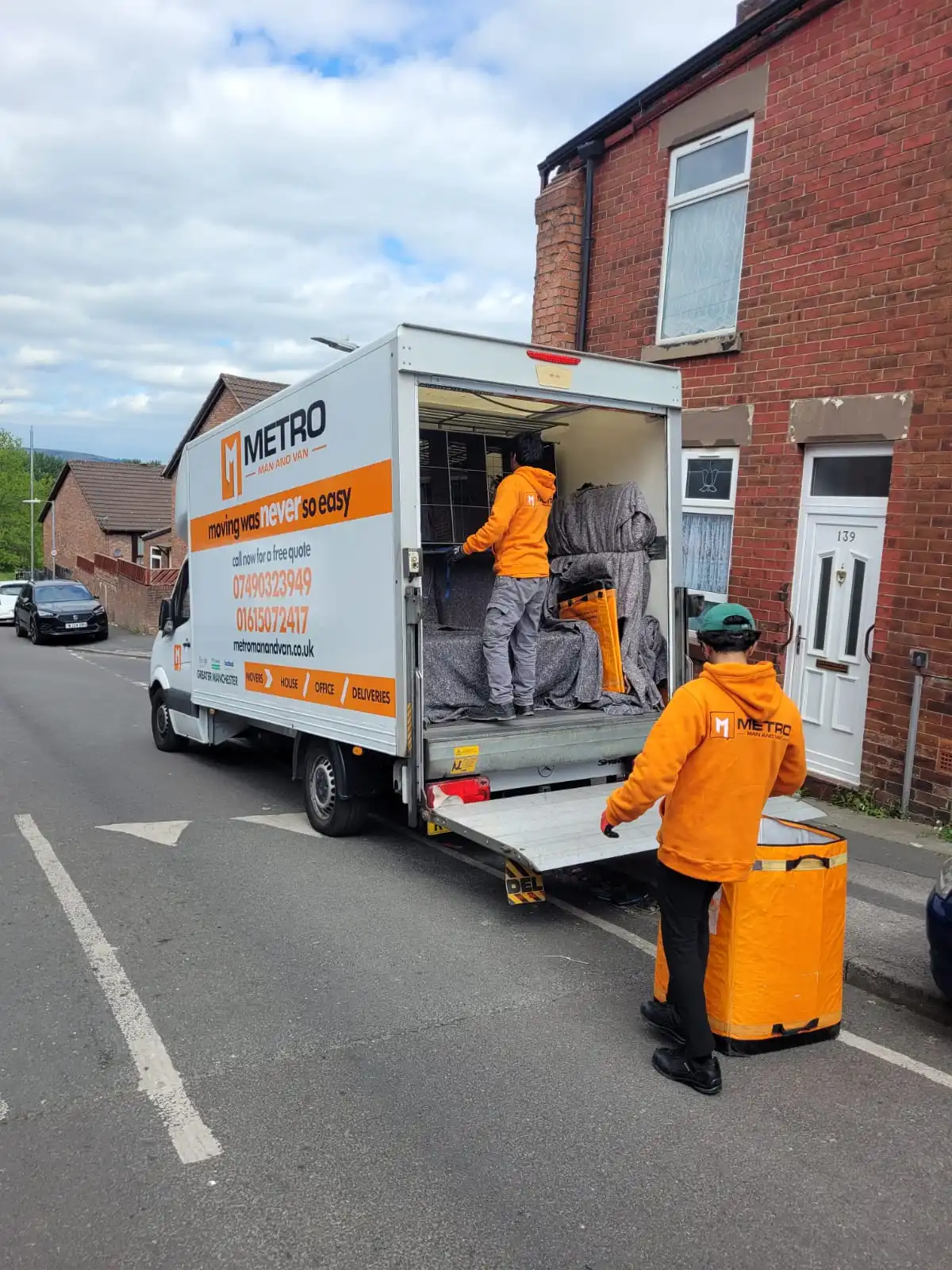 A person confidently using our guide for safe solo moving Manchester by checking the new lock on their apartment door.